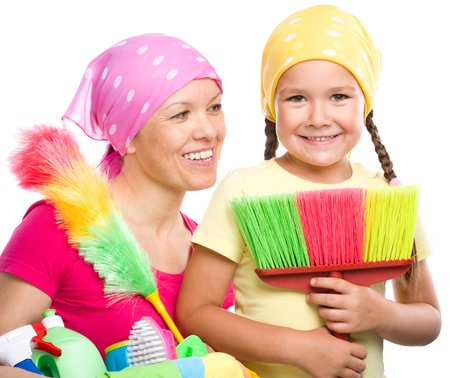 Happy mother and her daughter are dressed for cleaning, isolated over whiteの写真素材
