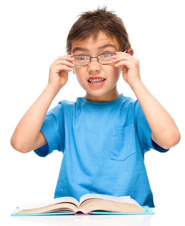 Cute little boy is wearing glasses, isolated over whiteの写真素材