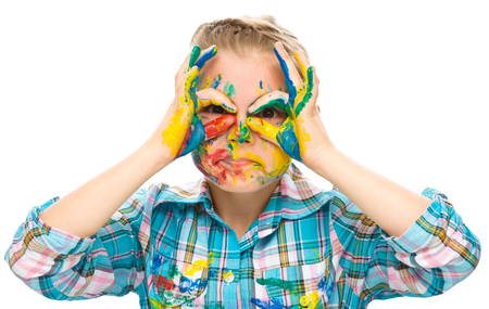 Portrait of a cute girl showing her hands painted in bright colors, isolated over whiteの写真素材