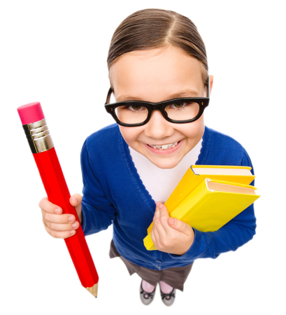 Funny little girl is holding books, fisheye portrait, isolated over whiteの写真素材