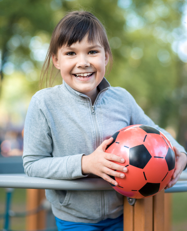 Cute little girl is playing in playground, outdoor shootの写真素材