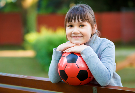 Cute little girl is playing in playground, outdoor shootの写真素材