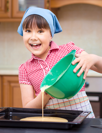 Girl is cooking in kitchen, indoor shootの写真素材