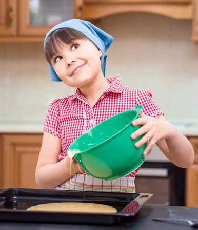 Girl is cooking, thinking while looking up, indoor shootの写真素材