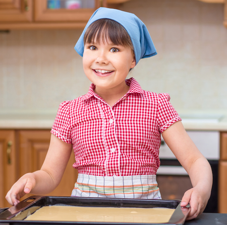 Girl is cooking in kitchen, indoor shootの写真素材