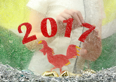 girl at the window makes Christmas Room, preparation for the new year