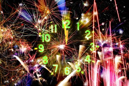 Festive Christmas background with a clock. The concept of the New Year. Abstract bright background of fireworksの写真素材