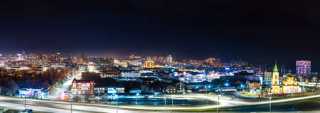 Barnaul, Russia. October 23, 2020. Night city with bright illumination. View from above. Near the river station of the city of Barnaul. Panoramic shot from Nagorny Park.のeditorial素材