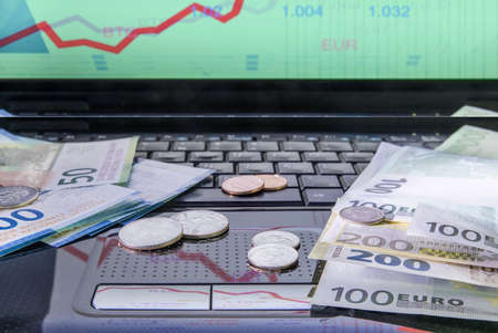 Money on the computer, franc, euro, cents. The concept of investment, exchange rate.の写真素材