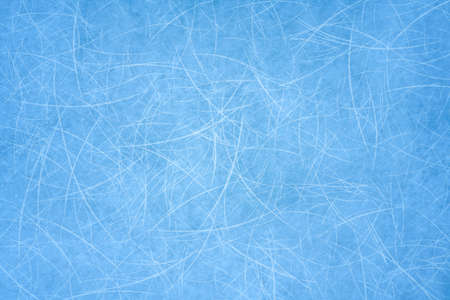 Ice blue background with ice skating tracks. Frozen water, sea. Frosty ice texture with winter...