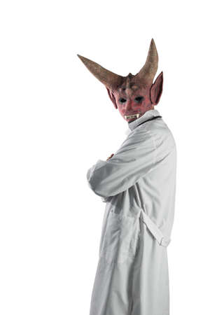 Devil in a medical gown on a white isolated background. The concept of deception in treatment....