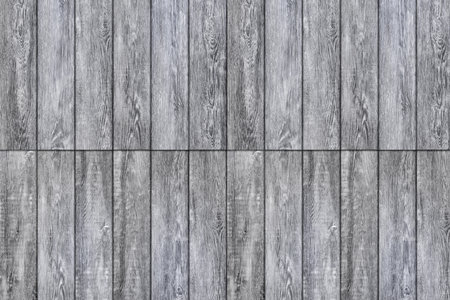 Laminate background. Texture of natural wood. The flooring is made of gray boards and panels. Parquet laid lengthwise, end to endの写真素材