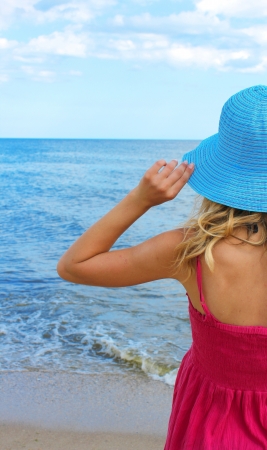 young woman on the shore of the seaの写真素材