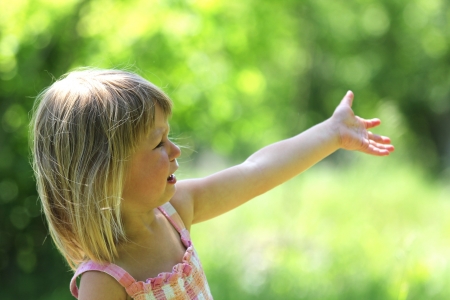 Beautiful little girl crying on the natureの写真素材