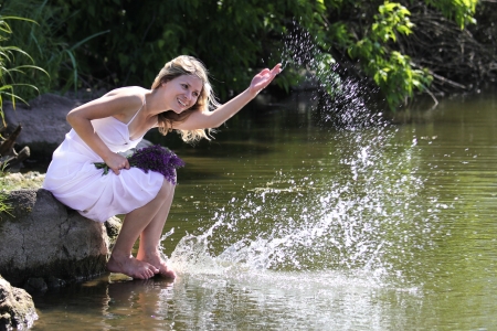 young beautiful woman smiling outdoorsの写真素材