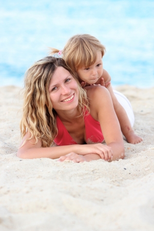Mother and daughter on the banks of the seaの写真素材
