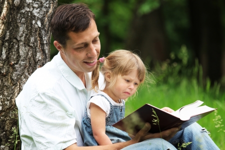 father and daughter reads the Bibleの写真素材