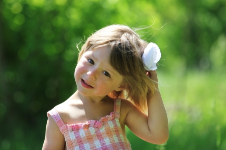 beautiful little girl on natureの写真素材