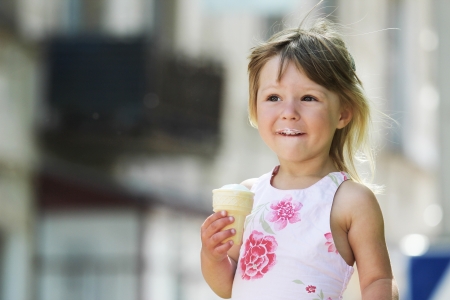 little girl eating ice creamの写真素材