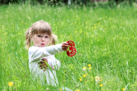 beautiful little girl on natureの写真素材