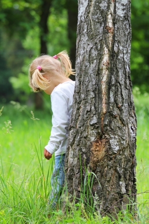 beautiful little girl on natureの写真素材