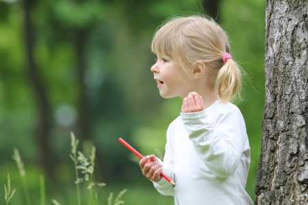 beautiful little girl on natureの写真素材