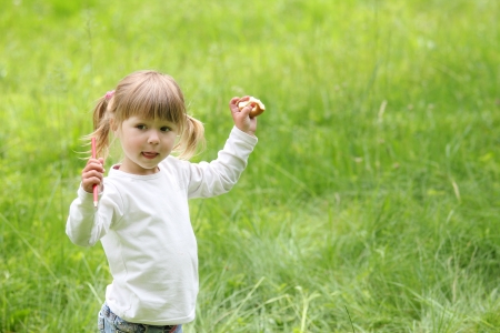 beautiful little girl play on natureの写真素材