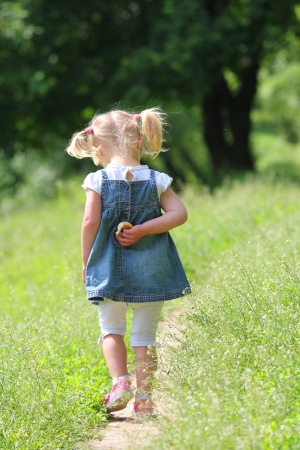 beautiful little girl on nature wolkの写真素材