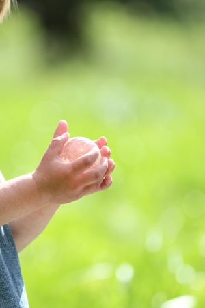 glass globe in children's handsの写真素材