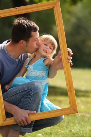 young father with his daughter in the frame の写真素材