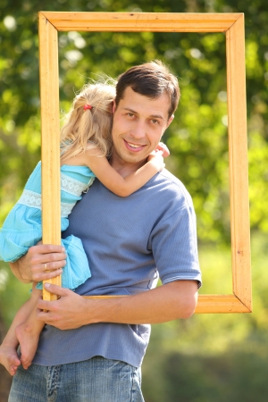 young father with his daughter in the frame の写真素材