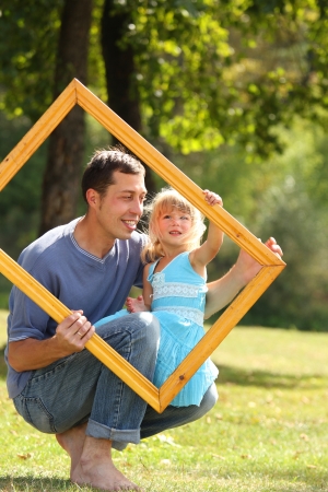 young father with his daughter in the frameの写真素材