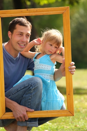 young father with his daughter in the frame の写真素材