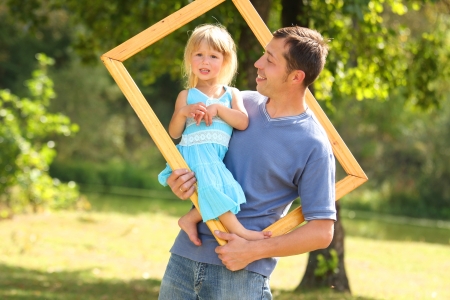young father with his daughter in the frame の写真素材