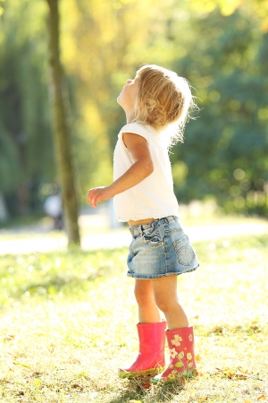 a very beautiful little girl on natureの写真素材