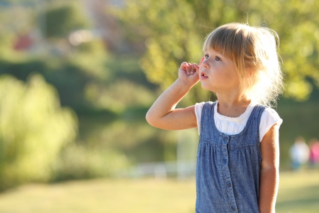 a very beautiful little girl on natureの写真素材