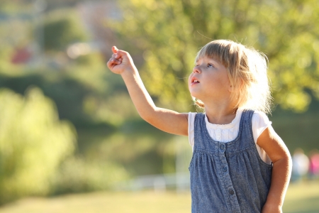a very beautiful little girl on natureの写真素材