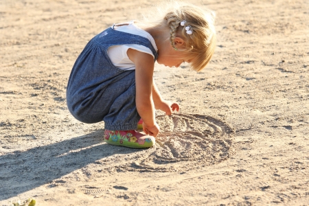 a very beautiful little girl on natureの写真素材