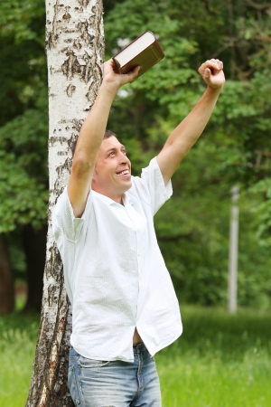 a young man reading the Bibleの写真素材