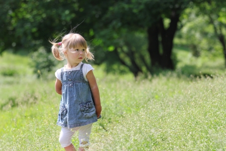 beautiful little girl on natureの写真素材