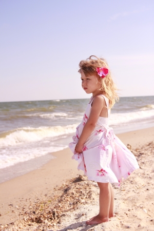 little girl on sea shoreの写真素材