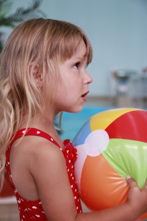 a little girl in the water poolの写真素材
