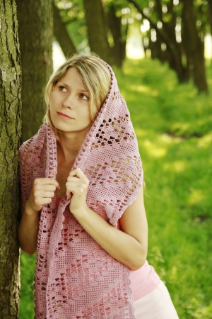 a young girl with a scarf on the natureの写真素材
