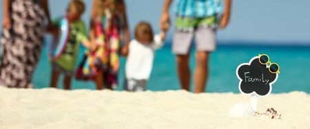 Happy family play  on the beach