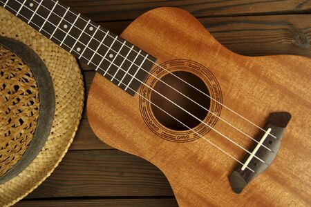 Ukulele musical instrument on wooden backgroundの写真素材