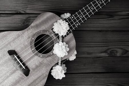 Ukulele musical instrument on wooden backgroundの写真素材