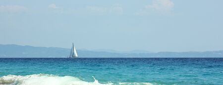 yacht on the blue sea in summer in Greeceの写真素材