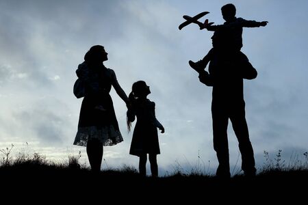 silhouette of a happy family with children on nature
の写真素材
