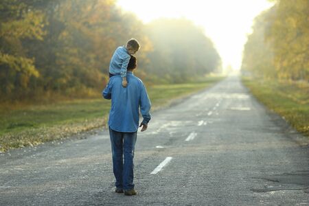 happy father and son walk in natureの写真素材