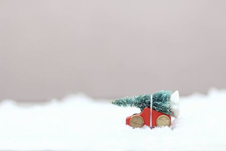 Christmas tree on a toy car with snowの写真素材